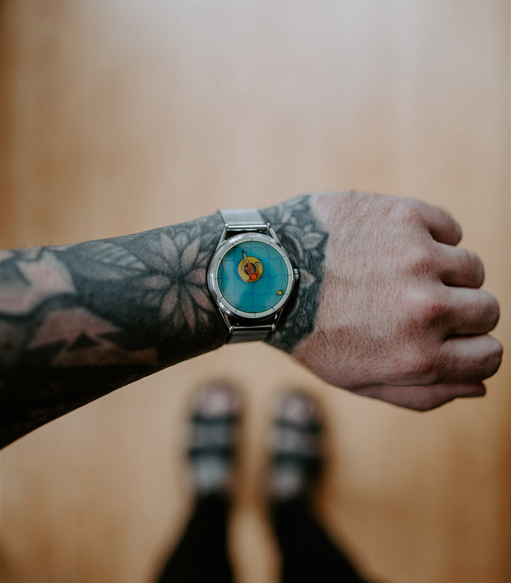 A perfectly useless afternoon mechanical on tattooed wrist